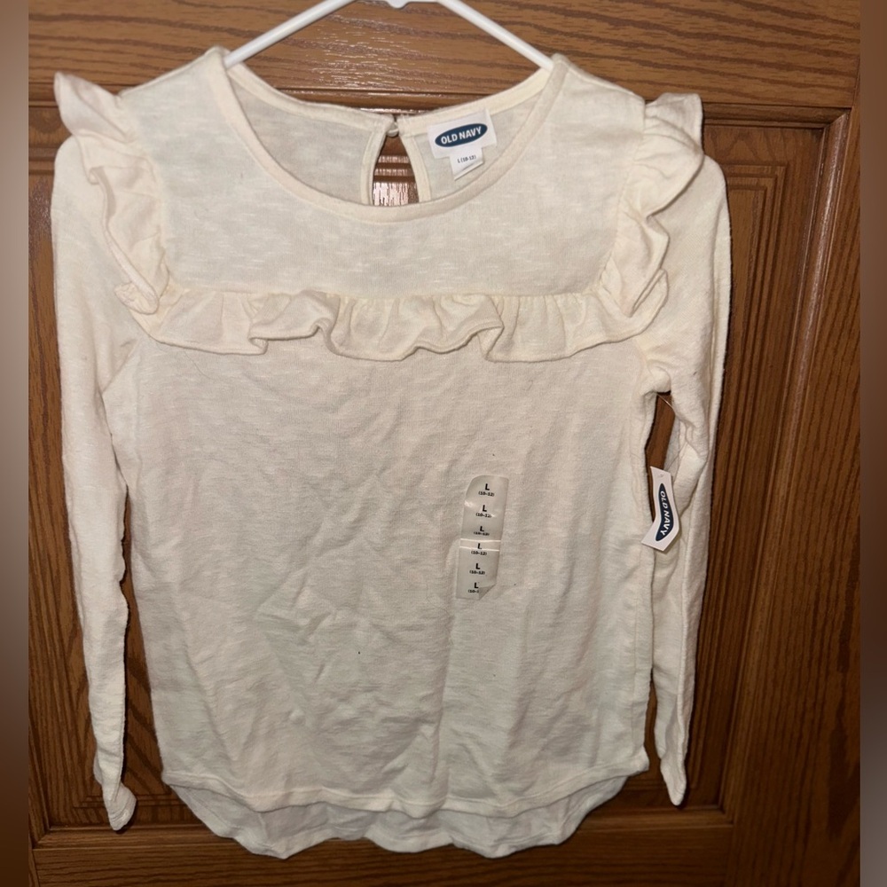 Long sleeve, ruffle Girls shirt cream colored